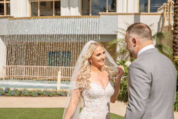 bride and groom's first look at the Sand pearl Resort on Clearwater Beach