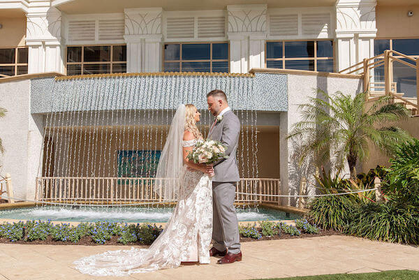 bride and groom in front of the fountain at the Sand Pearl Resort on Clearwater Beach