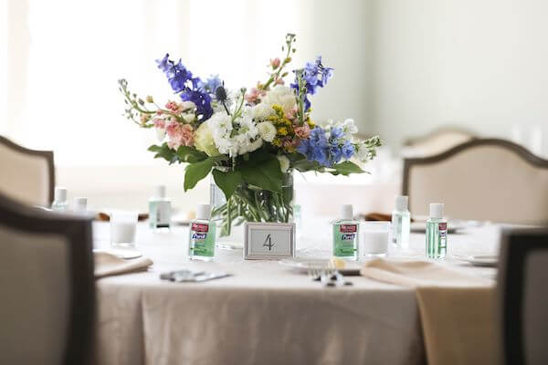 simple wedding centerpiece of colorful wildflowers