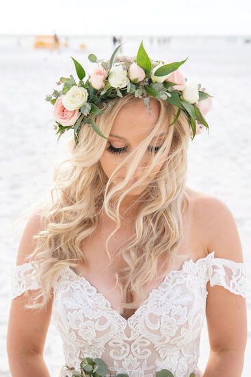 beautiful boho chic bride wearing flowers in her hair