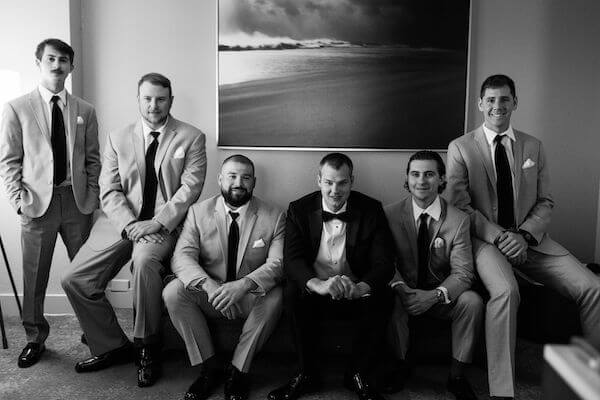 black and white photo of a groom and his groomsmen