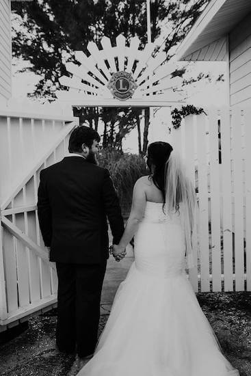 bride and groom making their entrance at their St Pete Lions Club Beach House wedding