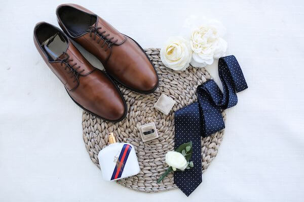 flatly photo of grooms accessories on his wedding day