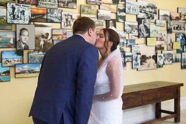 bride and groom kissing after their first look