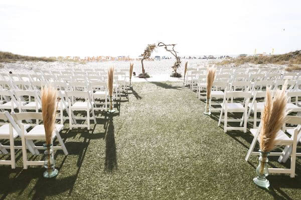 clearwater beach wedding set with beautiful grasses and a driftwood wedding arch