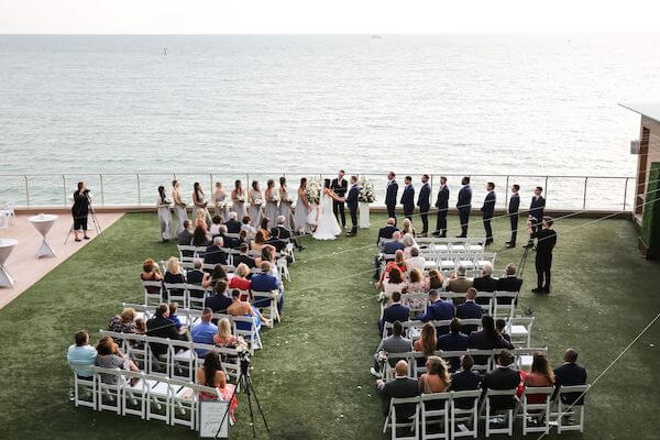 overhead view of a wedding ceremony on the Gulf Lawn at the Opal Sands Resort