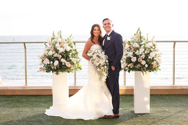 newlyweds posing for photos after their wedding ceremony