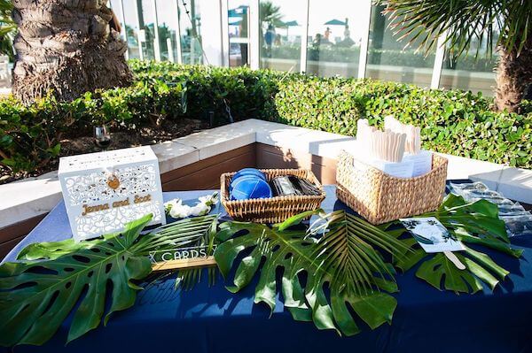 Ceremony table with wedding programs, kipper and card box