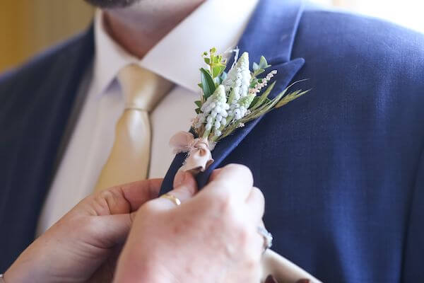 beautiful detailed groom's boutonniere