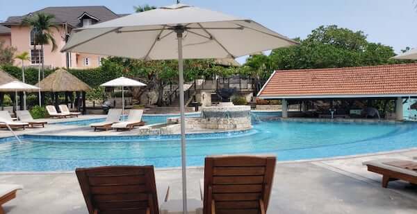 Beautiful pool with umbrellas and private cabanas