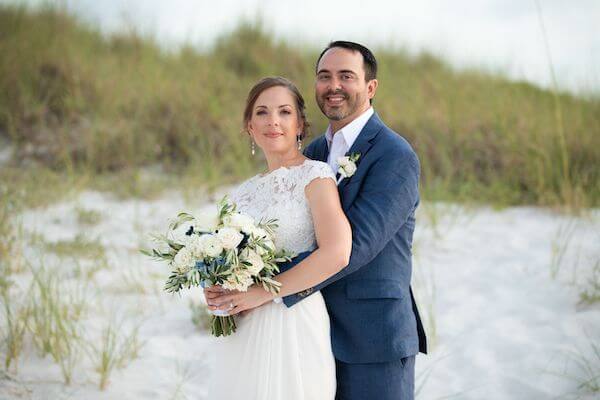 bride and groom posing for wedding photos on Clearwater Beach