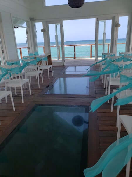 glass panels in the floor of the overwater wedding chapel