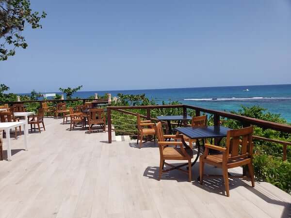 Deck overlooking the tropical waters at Sandals Ochi Beach Club