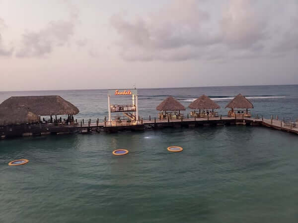 Waterfront cocktail huts at Sandals Ochi Beach Club