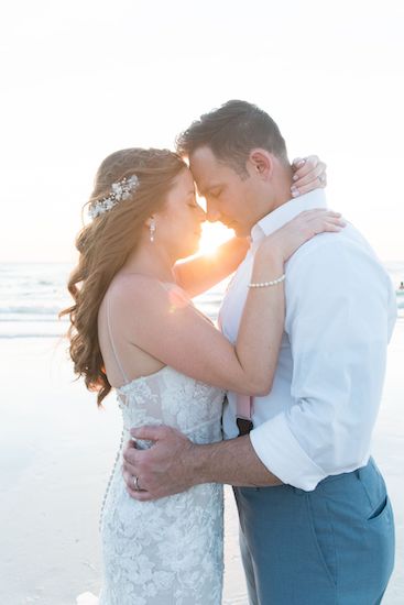 bride and groom on Clearwater Beach at sunset