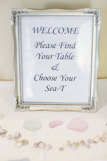 sea glass escort cards at a beach themed wedding reception