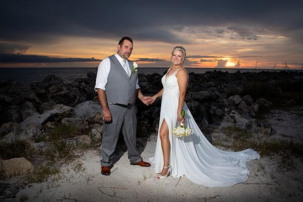 bride and groom at sunset on Clearwater Beach