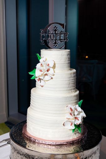 four tiered white wedding cake with sugar calla lilies