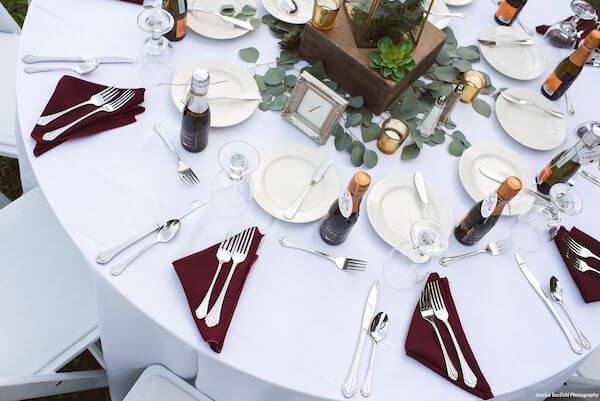 burgundy napkins against white linen