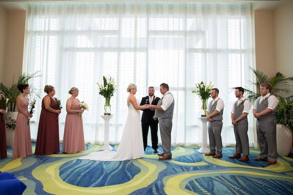 bride and groom getting married inside the Opal Sands Resort