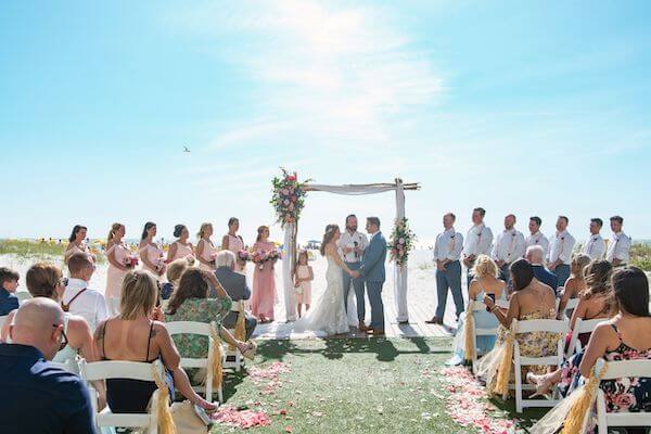 Bride and groom exchanging wedding vows on Clearwater beach