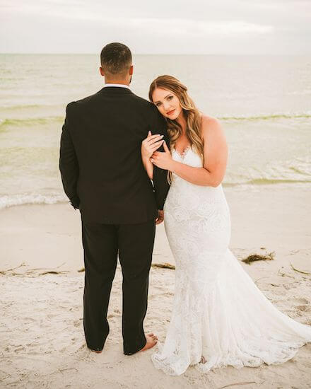 bride and groom posing for photos on Clearwater Beach