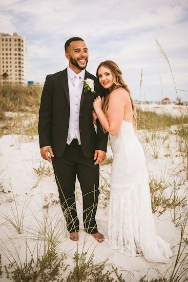 bride and groom posing for photos on Clearwater Beach