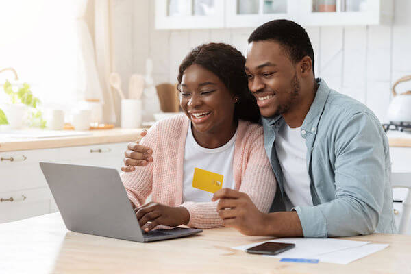 Engaged couple enjoying wedding planning because of their wedding planner