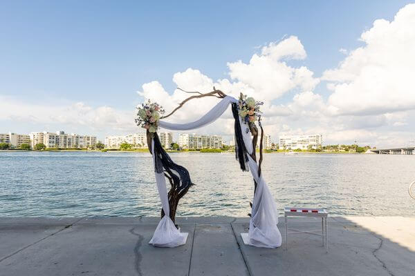 driftwood wedding arch at a st Pete beach wedding ceremony