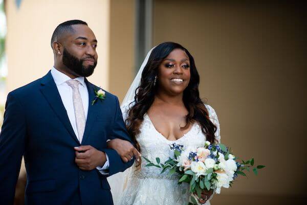 bride walking down the aisle at her st Pete beach wedding