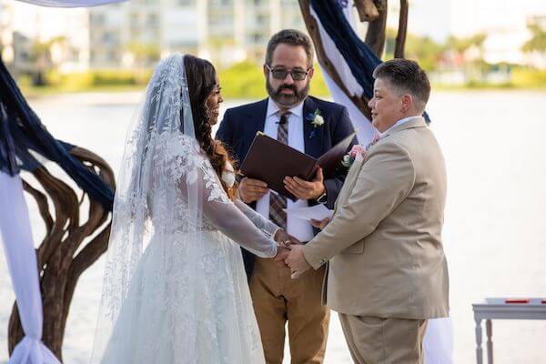 Couple exchanging wedding vows at their st Pete beach wedding