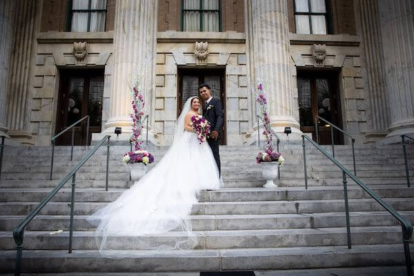 bride and groom on the steps of  the Le Meridien Hotel Tampa