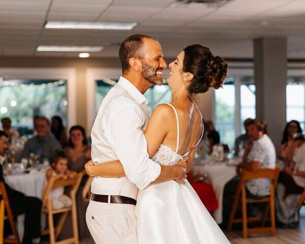 laughing bride and groom during their first dance