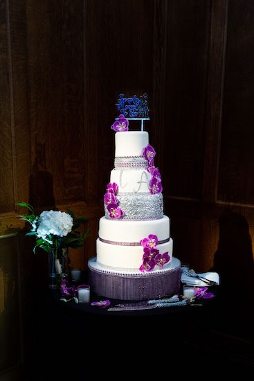 A five tier white and silver wedding cake for a nightmare before Christmas themed halloween wedding