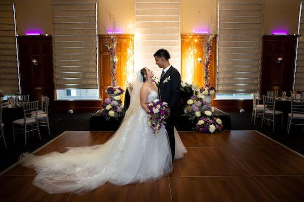 bride and groom in front of a sparkler fountain in the ballroom of the Le Meridien Tampa