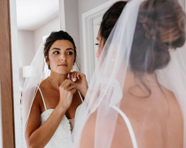 bride looking in the mirror