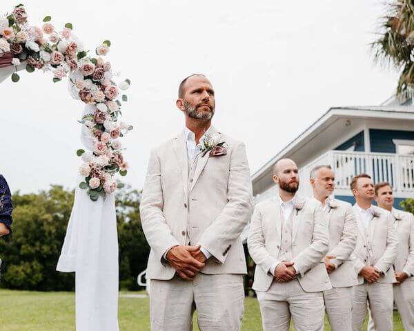 Groom waiting for his bride to walk down the aisle at Tampa Bay Watch