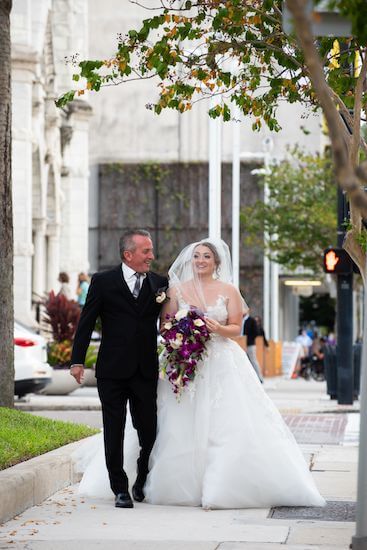 bride and her father heading toward her halloween wedding