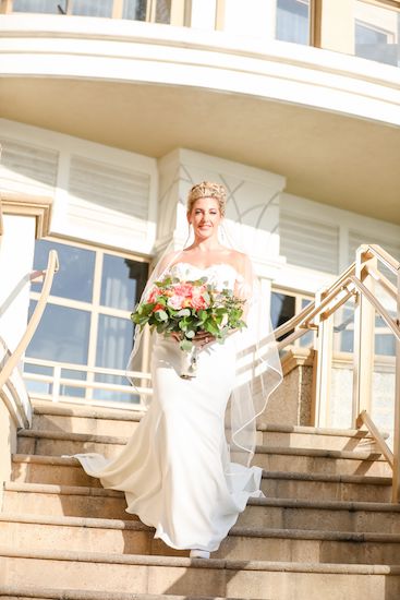 bride walking down the stairs of the Sandpearl Resort on Clearwater Beach