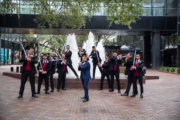 Tampa Bay groom and his groomsmen with lightsabers