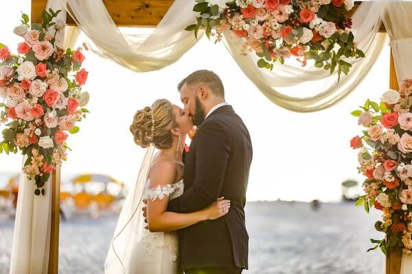 bride and groom first kiss