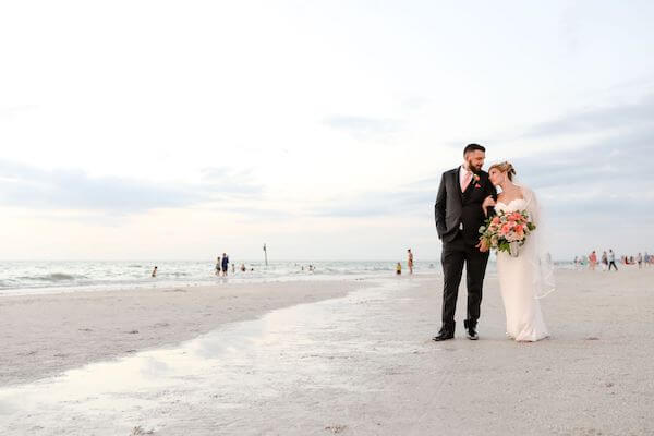 bride and groom on CLEARWATER BEACH after their wedding ceremony