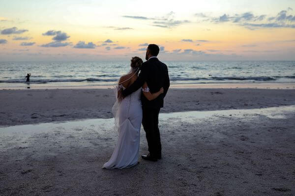 bride and groom on CLEARWATER BEACH at sunset