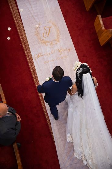 bride and groom processing in togehter during their Tampa Bay Coptic  Orthodox wedding ceremony