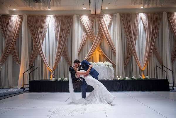 Tampa groom dipping his bride as they practice thier first dance