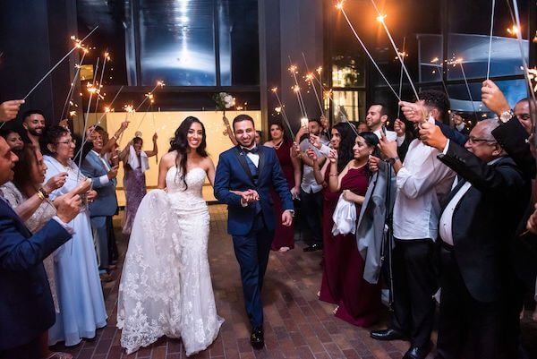 bride adn groom during a sparkler grand exit