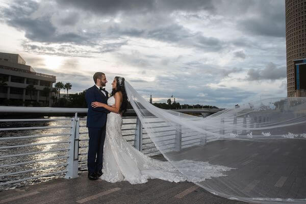 bride and groom on the Tampa waterfront at sunset