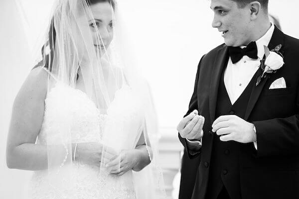 Bride and groom under a chuppah during their Clearwater beach Jewish wedding