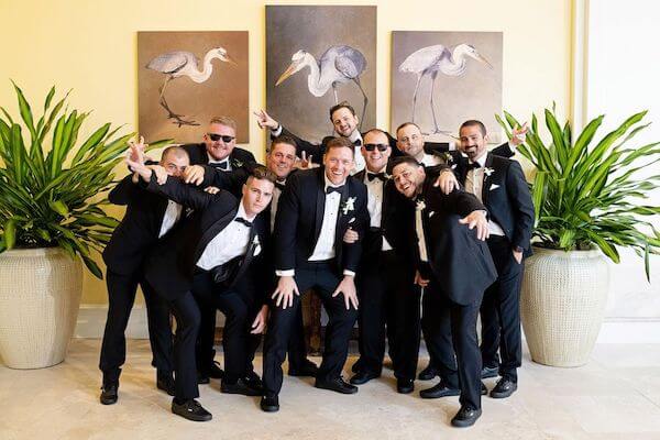 groom and his groomsmen having fun at the Sandpearl Resort