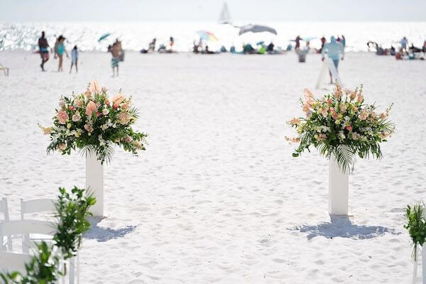 Wedding ceremony with pink and white florals on the North beadch at Clearwater Beach's Sandpearl Resort